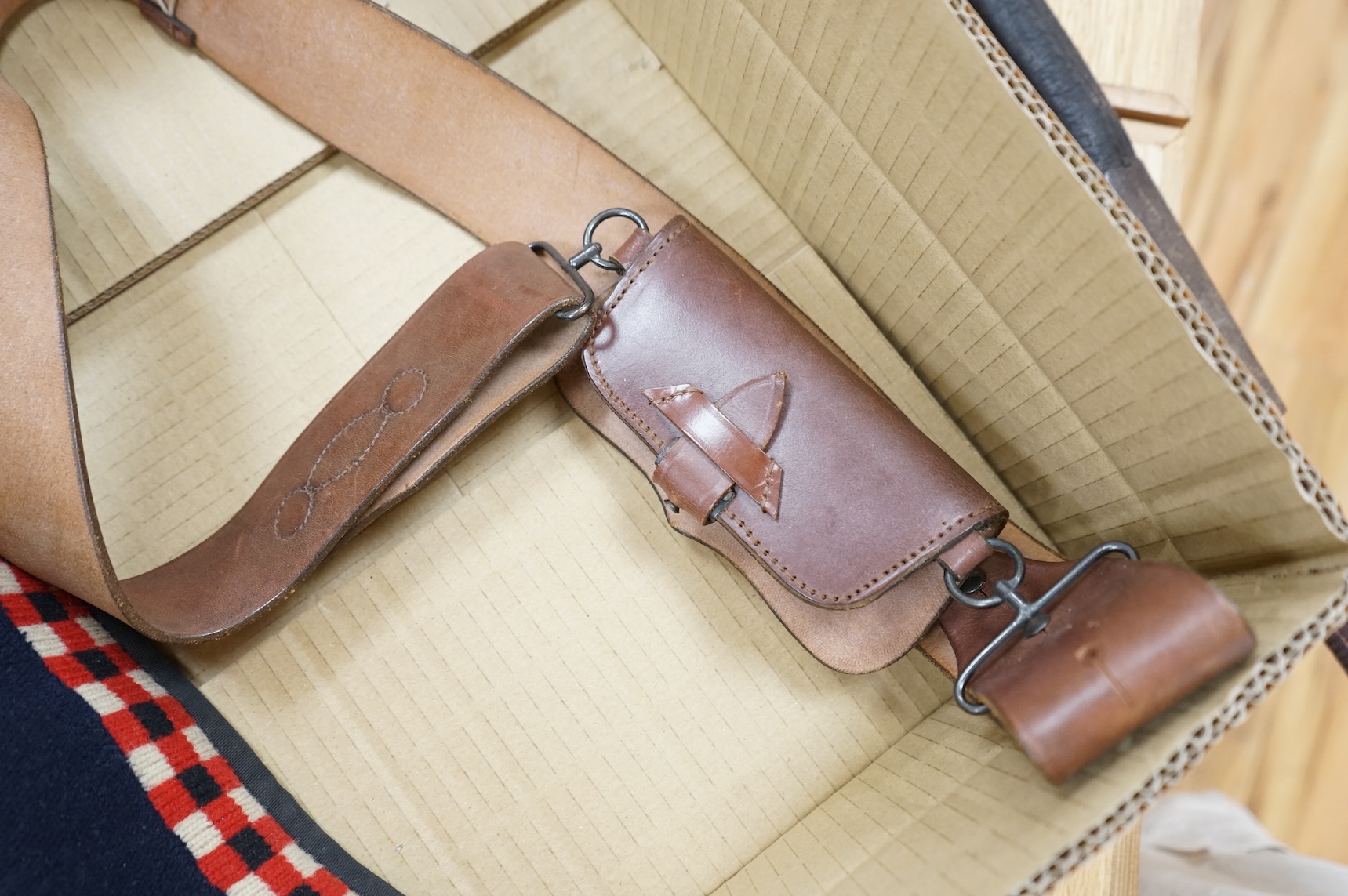 A 1907 bayonet in its scabbard with the tip of the blade shortened, together with a Glengarry cap of the KOSB, post 1902 badge and a brown leather shoulder belt and pouch with QE2 bronze badge of the Royal Artillery